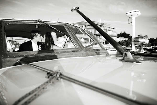 bride and groom kissing in vintage car - real wedding photo by Seattle photographers GH Kim Photography